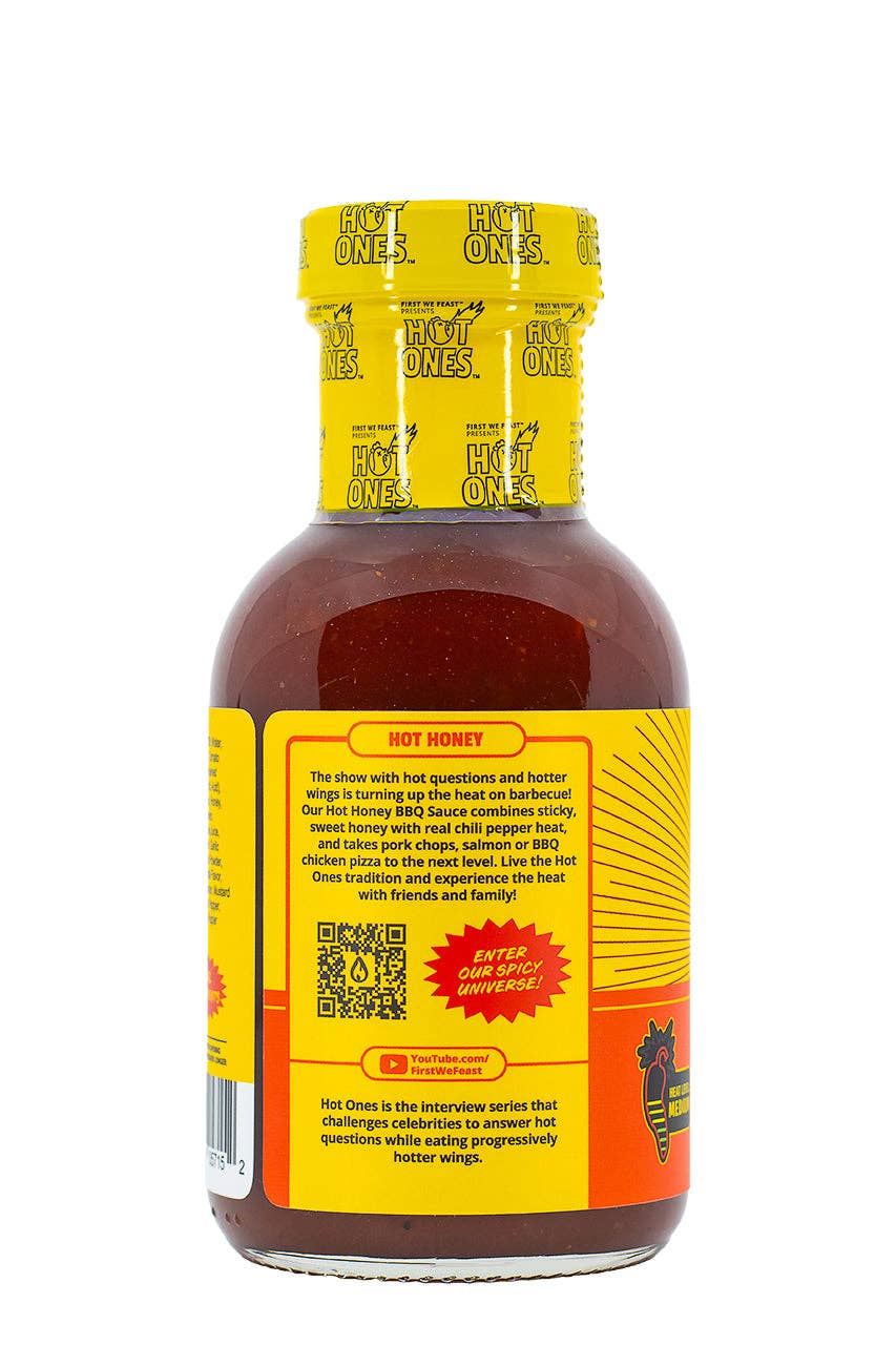 Hot Ones hot sauce bottle with yellow cap and label on a white background