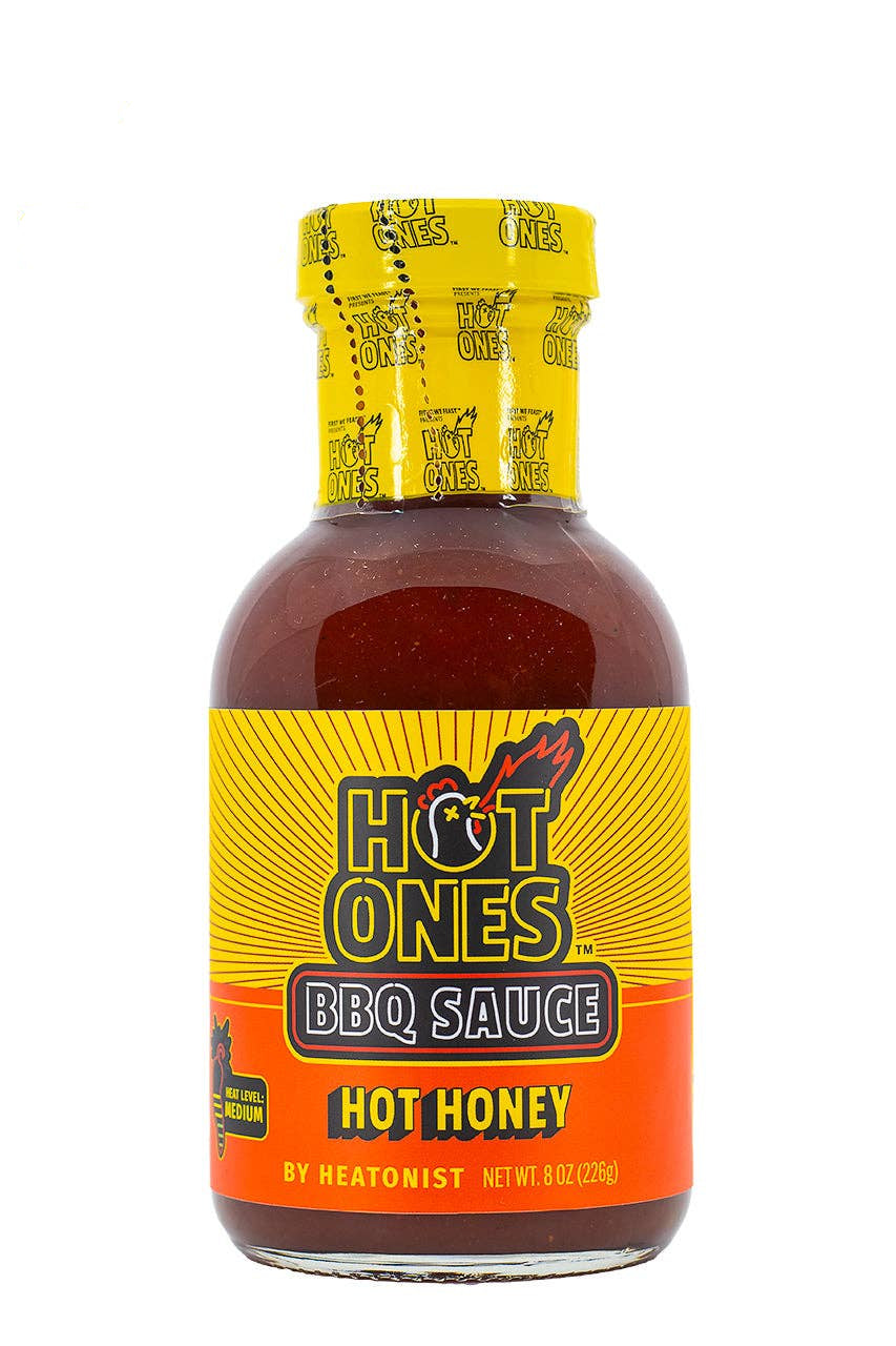 Bottle of Hot Ones BBQ Sauce with yellow and orange label on a white background