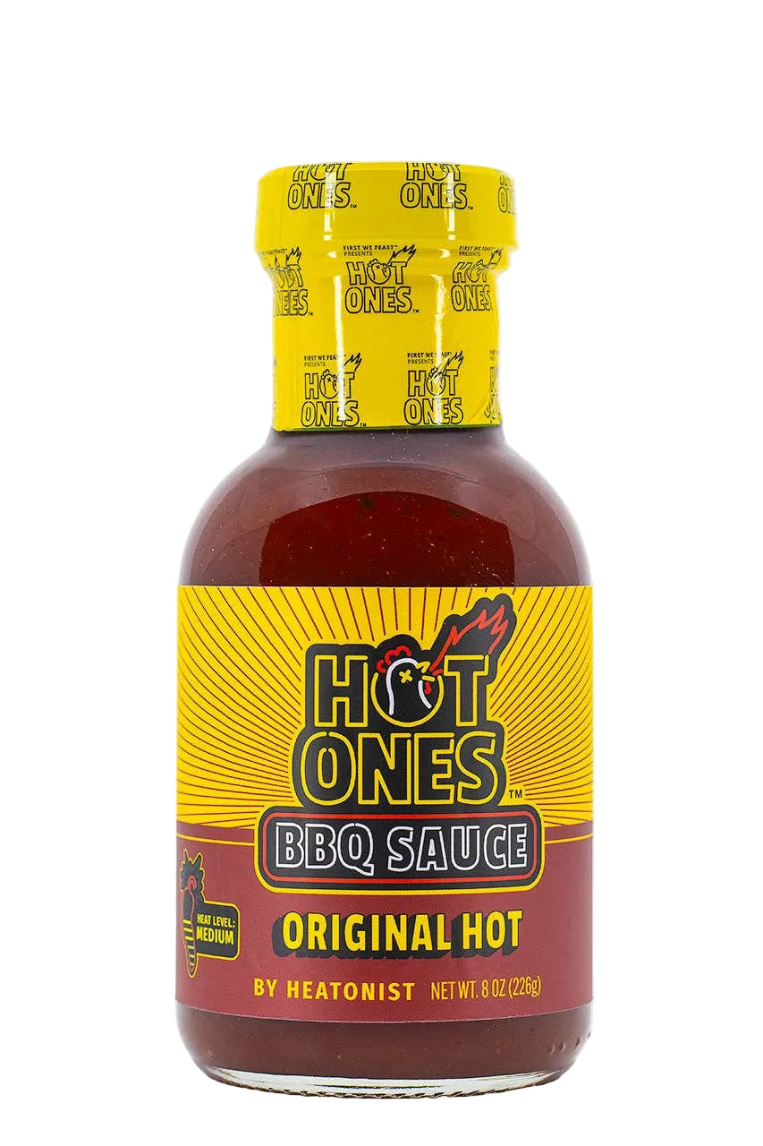 Bottle of Hot Ones BBQ Sauce with yellow cap and label on a white background