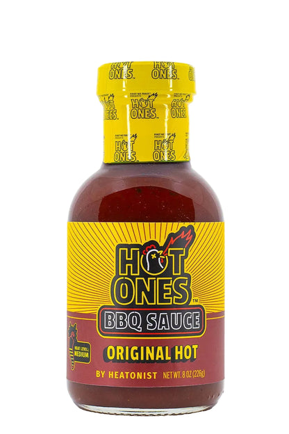 Bottle of Hot Ones BBQ Sauce with yellow cap and label on a white background