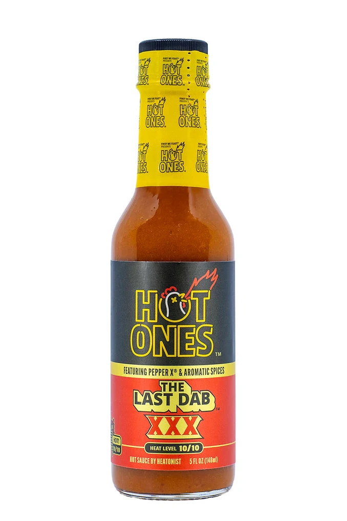 Hot Ones hot sauce bottle with a yellow label on a white background