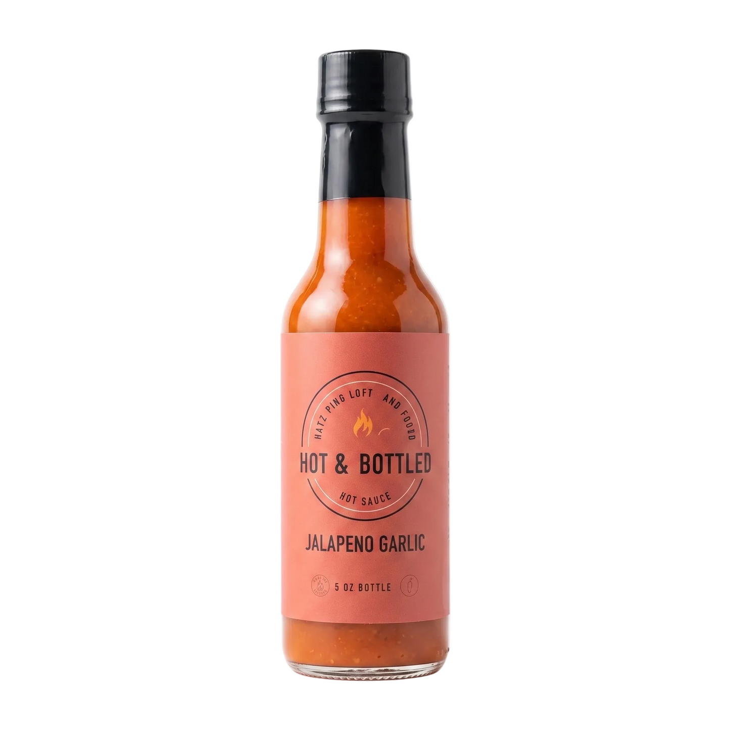 Bottle of Hot & Bottled Jalapeno Garlic hot sauce on a white background