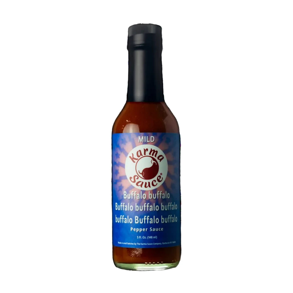 Bottle of Karma Buffalo Sauce on a white background