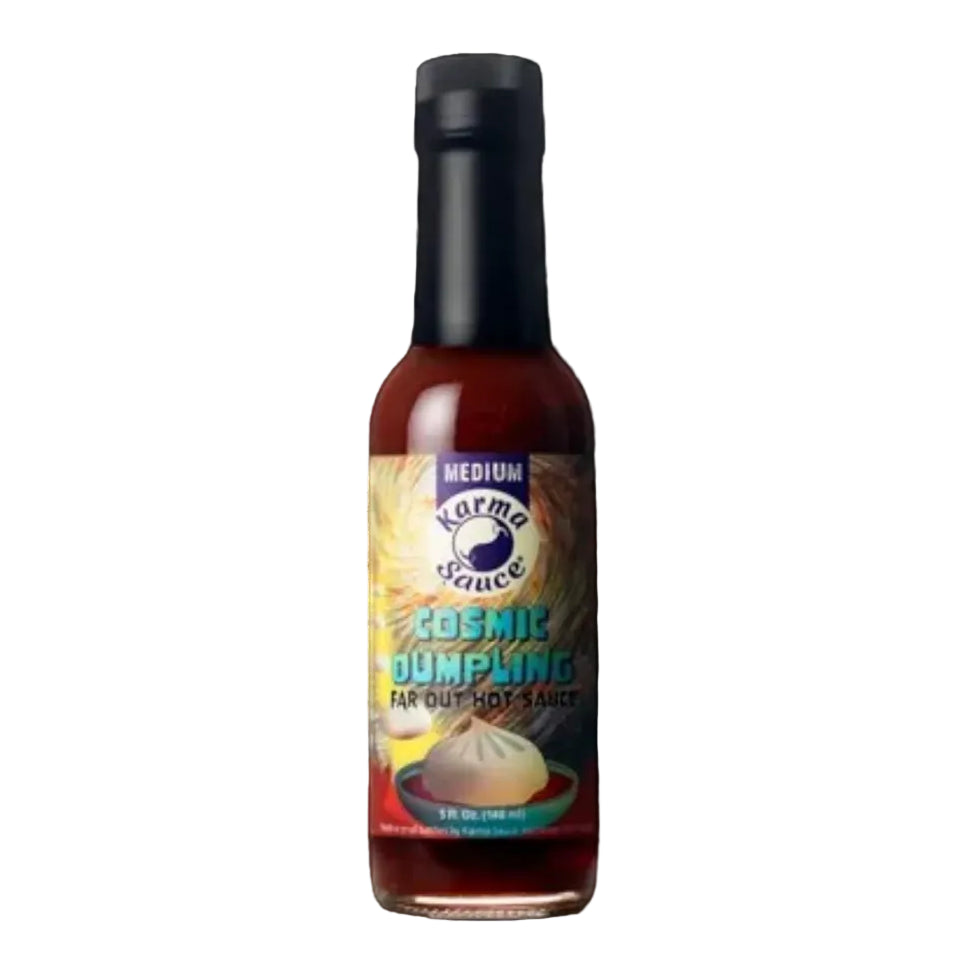 Bottle of Karma Sauce Cosmic Dumpling Harissa Hot Sauce on a white background