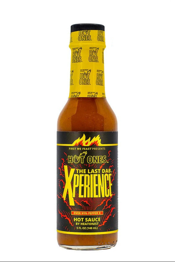 Hot Ones hot sauce bottle with yellow label on a white background