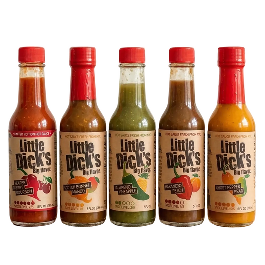 Five bottles of Little Dick's hot sauce on a wooden surface with a white background