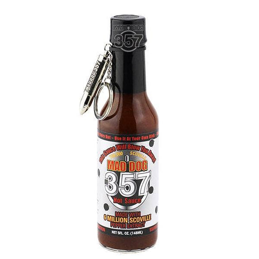 Mad Dog 357 Hot Sauce Pepper Spray bottle with a black cap and a silver keychain attached, shown on a plain white background.