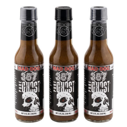 Three bottles of Mad Dog 357 Pure Ghost hot sauce on a white background
