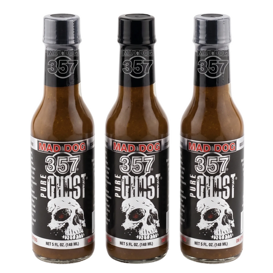 Three bottles of Mad Dog 357 Pure Ghost hot sauce on a white background