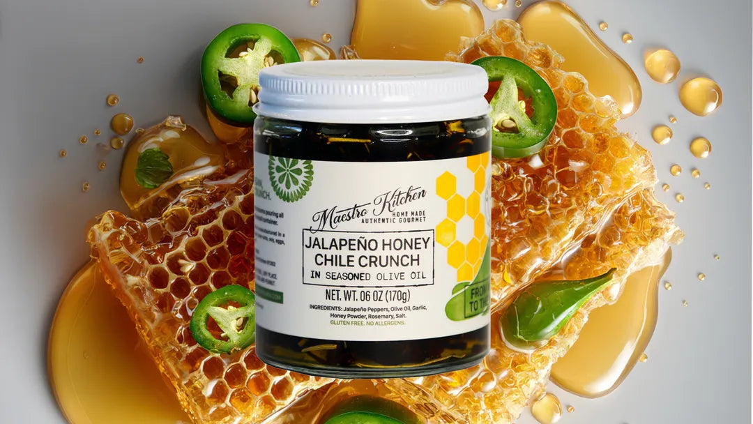 Jar of jalapeno honey chile crunch on a honeycomb with honey drizzled over it.