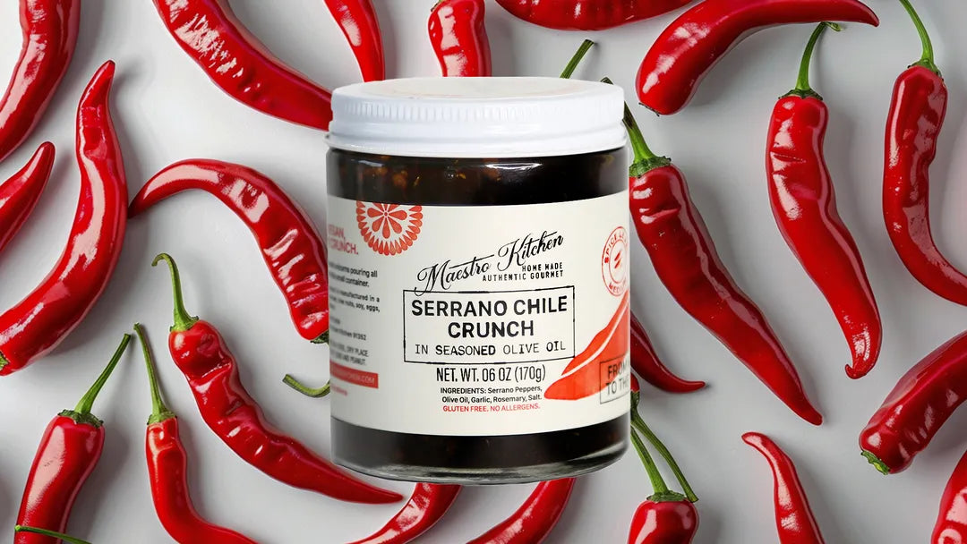 Maestro Kitchen Serrano Chile Crunch with peppers surrounding the jar