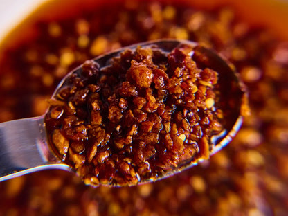 Close-up of a spoonful of chili crisp