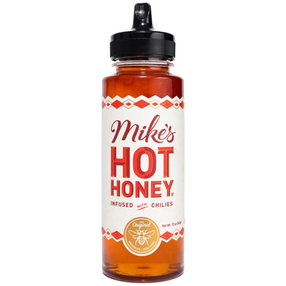 Bottle of Mike's Hot Honey with a white label on a white background