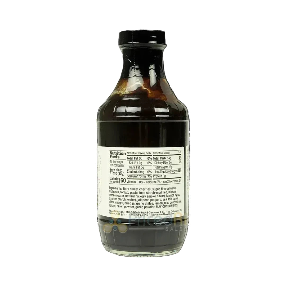 Bottle of dark liquid with a label on a white background