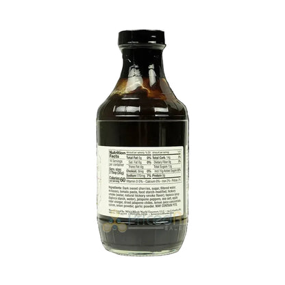 Bottle of dark liquid with a label on a white background