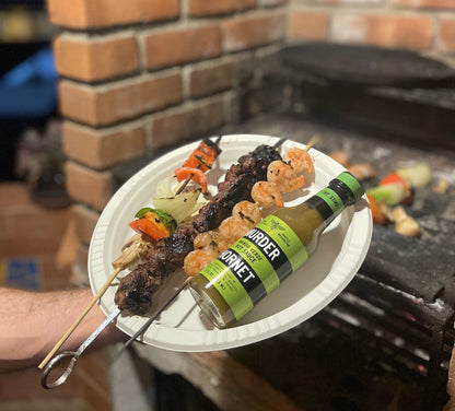 Murder Hornet Mango Verde hot sauce with kabobs