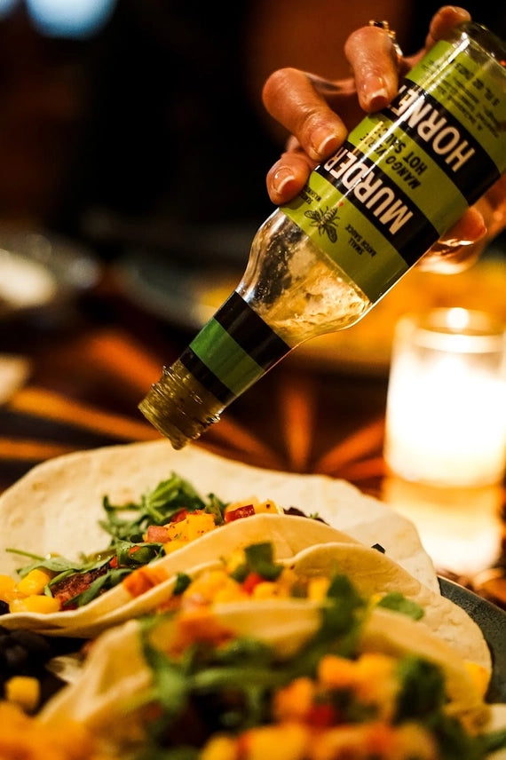 Murder Hornet Mango Verde Hot Sauce on tacos