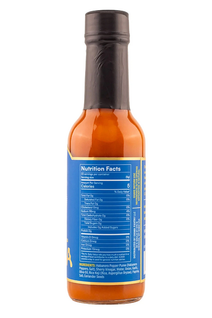 Hot sauce bottle with nutrition facts label on a white background