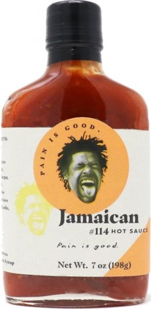 Bottle of Jamaican hot sauce with a label featuring a face and text.