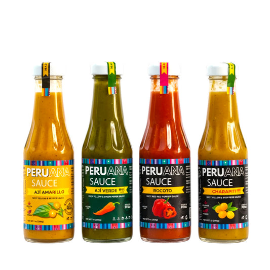 Four bottles of Peruana Sauce with colorful labels on a white background
