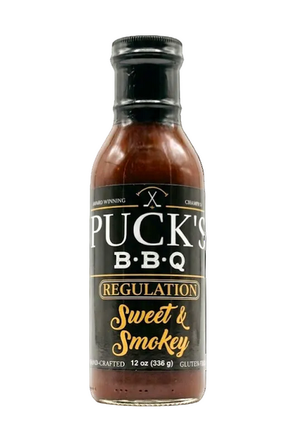 Bottle of Puck's BBQ Sweet & Smokey sauce on a white background