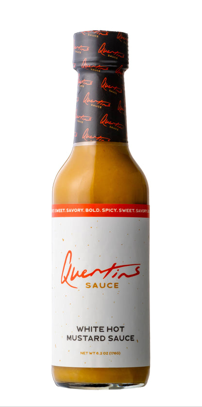 Bottle of Quentins White Hot Mustard Sauce on a white background
