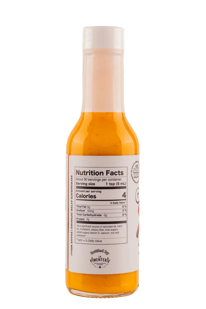 Bottle of hot sauce with nutrition facts label on a white background