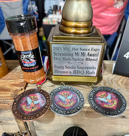 Spice blend with awards and a trophy on a wooden surface