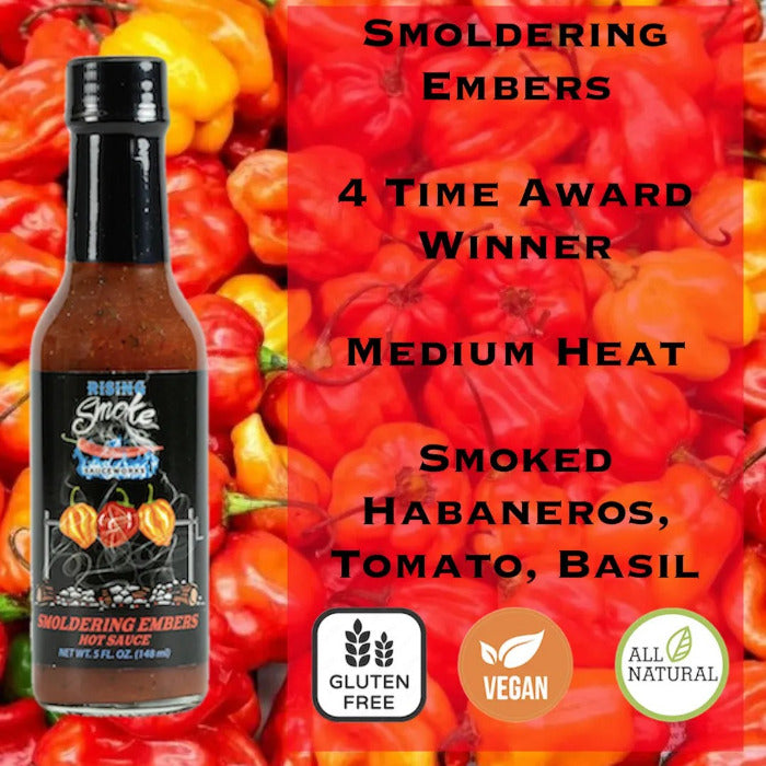 Rising Smoke Smoldering Embers Hot sauce bottle with habanero peppers and product details on a red pepper background