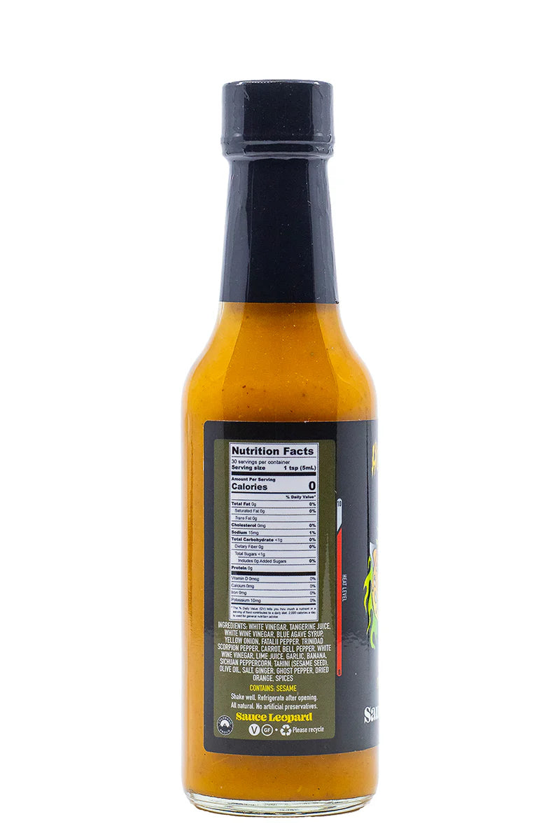 Bottle of hot sauce with nutrition facts label on a white background