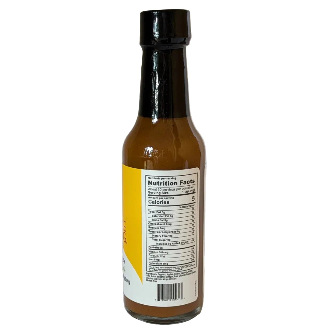 Bottle of Scoville Warming Green Apple Chipotle hot sauce with a nutrition facts label on a white background