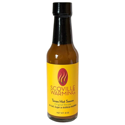 Bottle of Scoville Warming Texas Hot Sauce on a white background