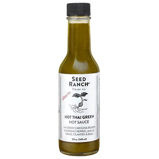 Bottle of Seed Ranch Hot Thai Green Hot Sauce on a white background