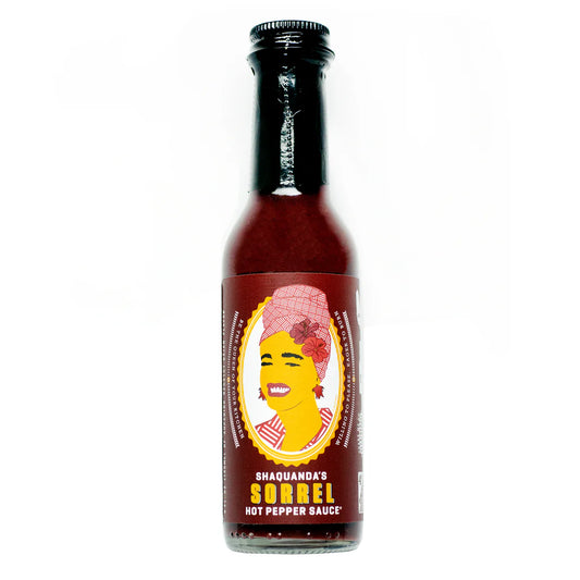 Bottle of Shaquanda's Sorrel Hot Pepper Sauce on a white background
