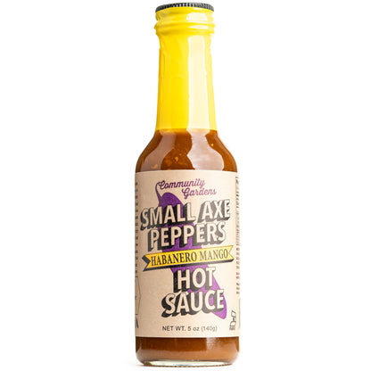 Bottle of Small Axe Peppers Habanero Mango Hot Sauce on a white background