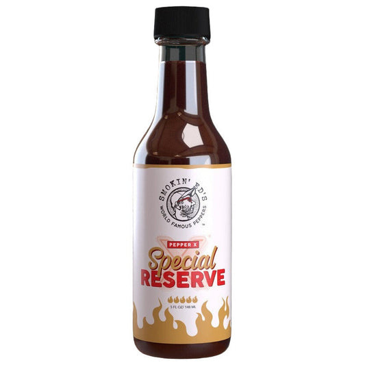 Bottle of Smokin Ed's Special Reserve pepper X sauce on a black background