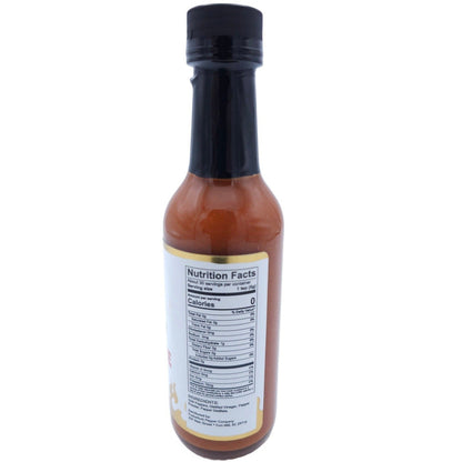 Bottle of Smokin Ed's Special Reserve X hot sauce with a black cap on a white background