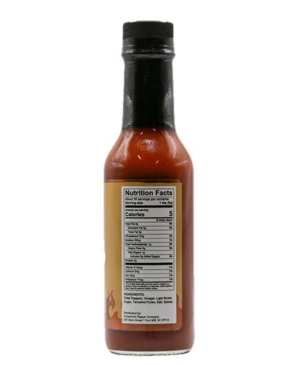 A bottle of hot sauce with a black cap and a tan label showing the Nutrition Facts panel, isolated on a white background.