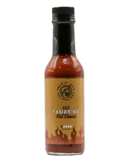 A bottle of Smokin' BBQ Kibbit Tamarind Hot Sauce on a plain white background.