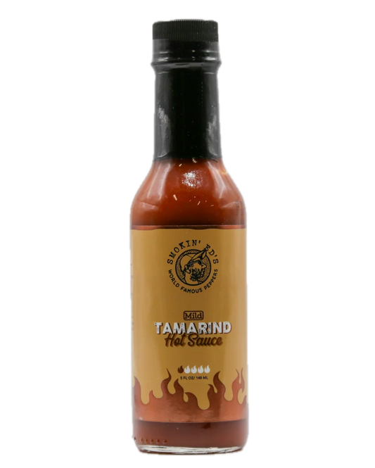 A bottle of Smokin' BBQ Kibbit Tamarind Hot Sauce on a plain white background.