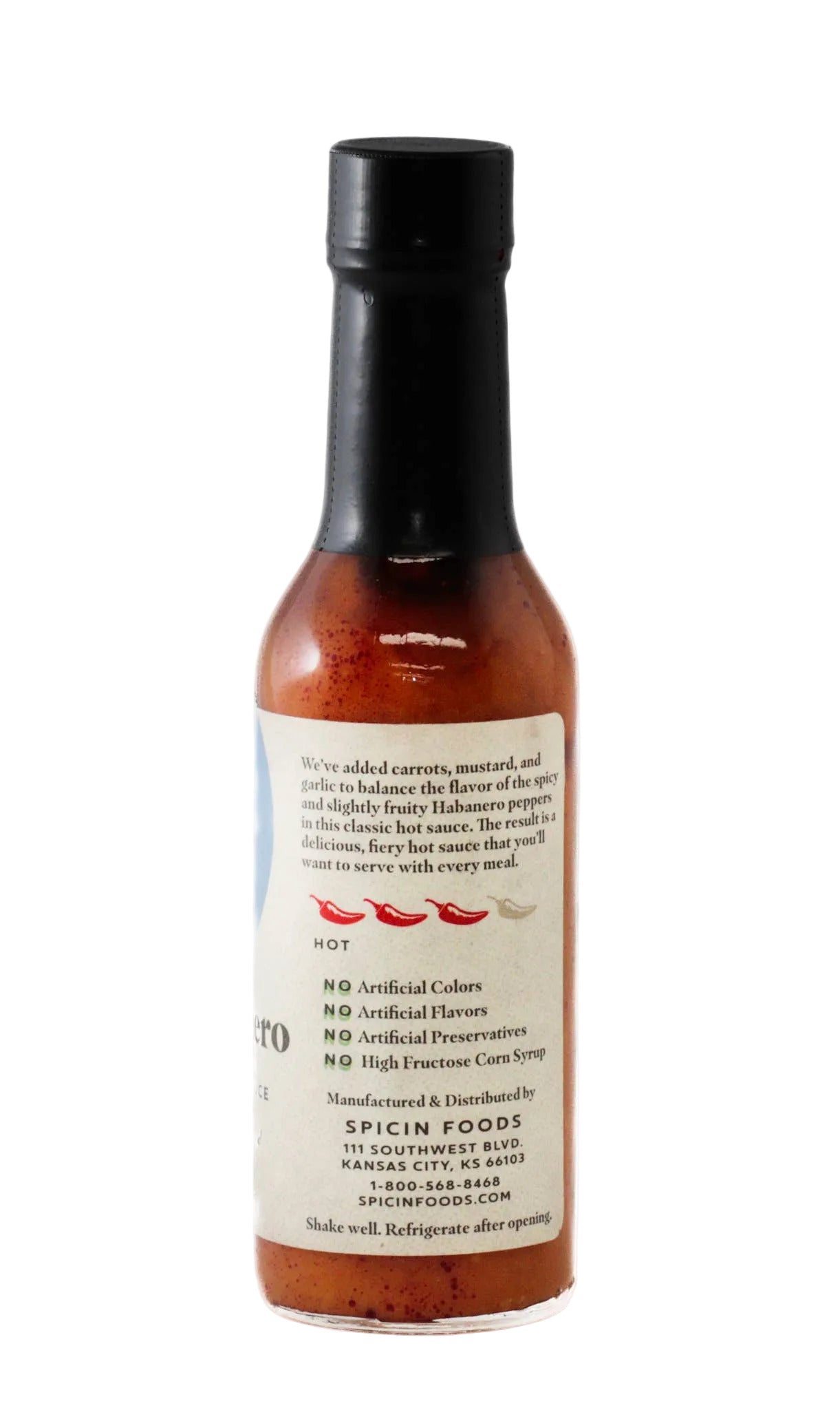 Hot sauce bottle with label on a white background