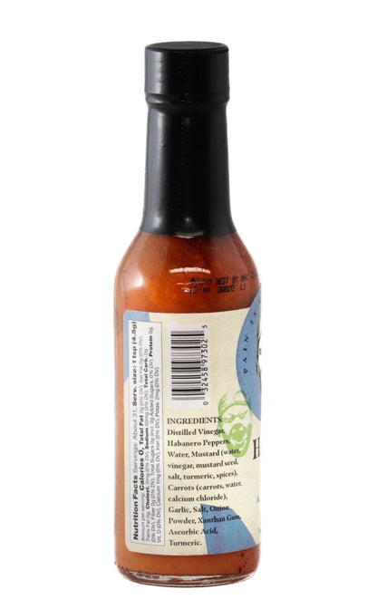 Bottle of habanero hot sauce ingredients with a black cap on a white background