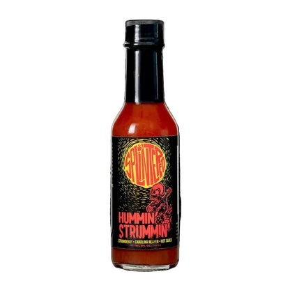 Splintered Hummin Strummin Hot sauce bottle with a label on a white background