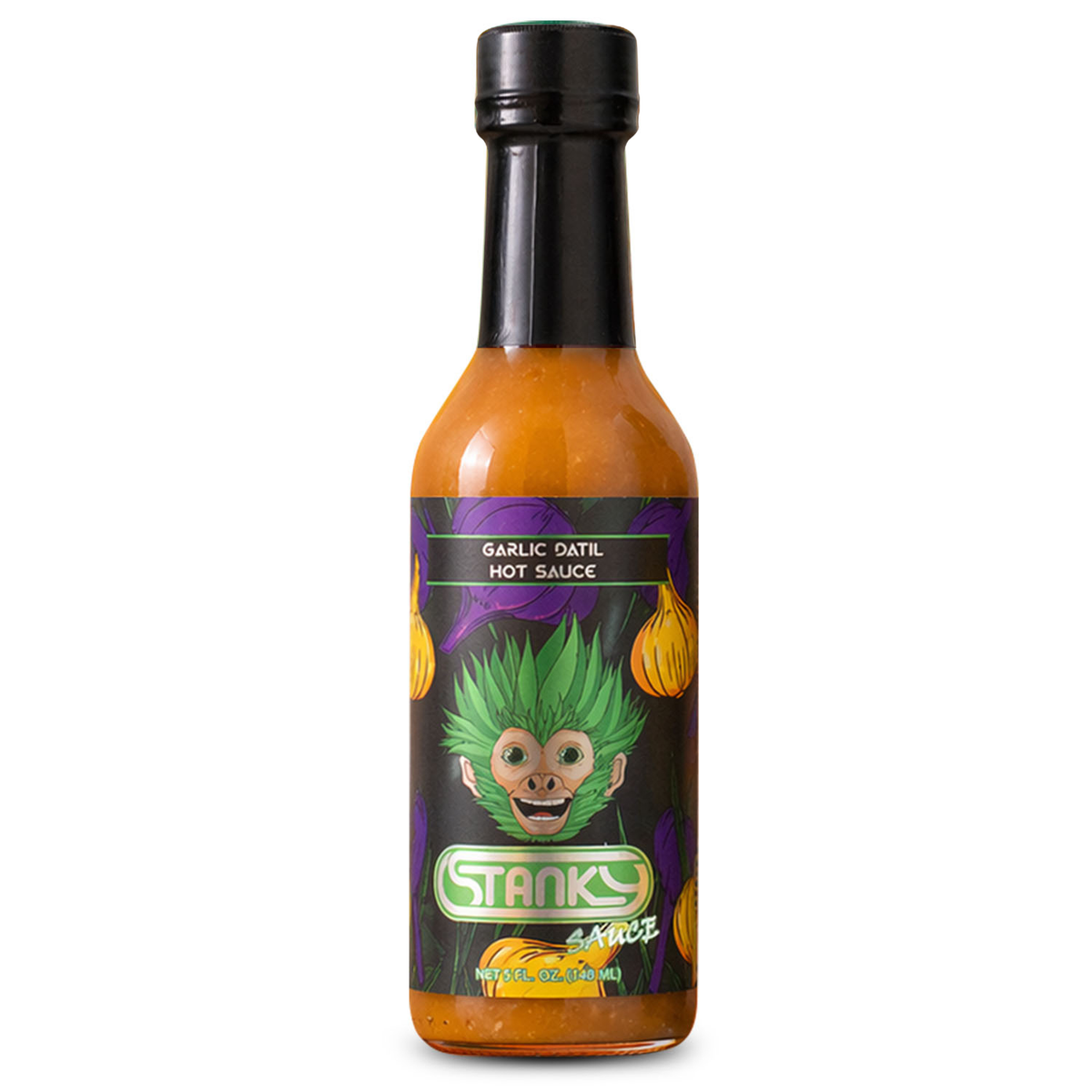 A bottle of Stanks Garlic Dail Hot Sauce on a solid white background. The bottle contains a vibrant orange-red sauce and features a black cap and a black label with a cartoon illustration of a green-haired character and purple garlic bulbs.