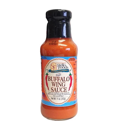 Bottle of Stello Foods Buffalo Wing Sauce with red peppers in the background