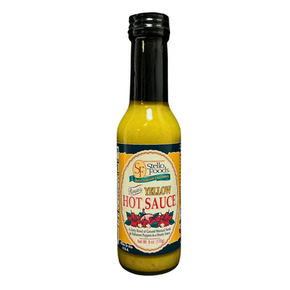 Bottle of Stello Foods Yellow Hot Sauce on a white background