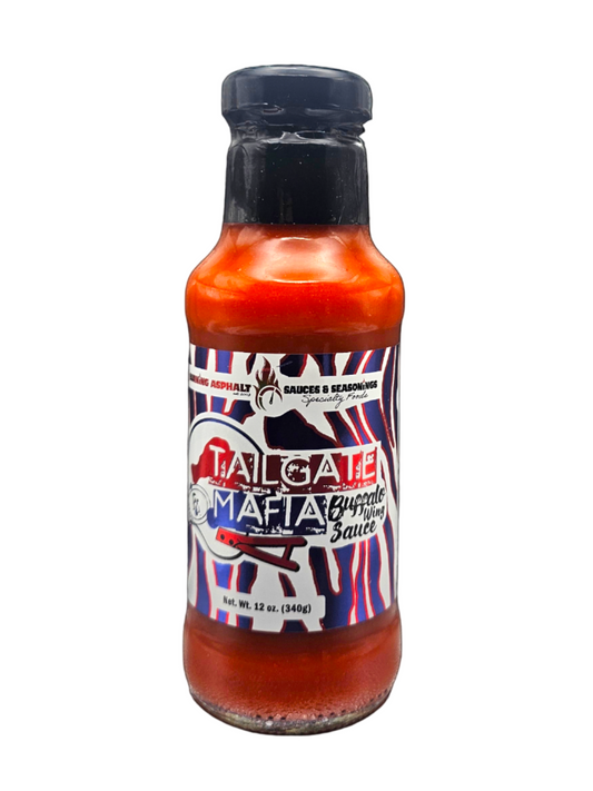 Bottle of Taligala sauce on a white background