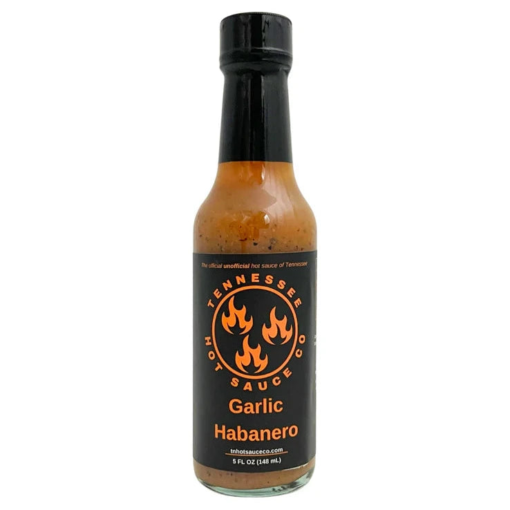 Bottle of Garlic Habanero sauce with a black label on a white background