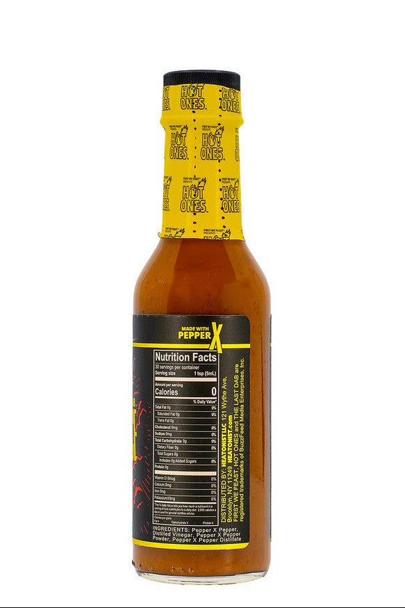 The Last Dab Xperience Hot sauce bottle with yellow label on a white background