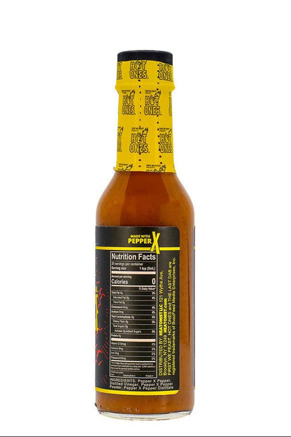 The Last Dab Xperience Hot sauce bottle with yellow label on a white background